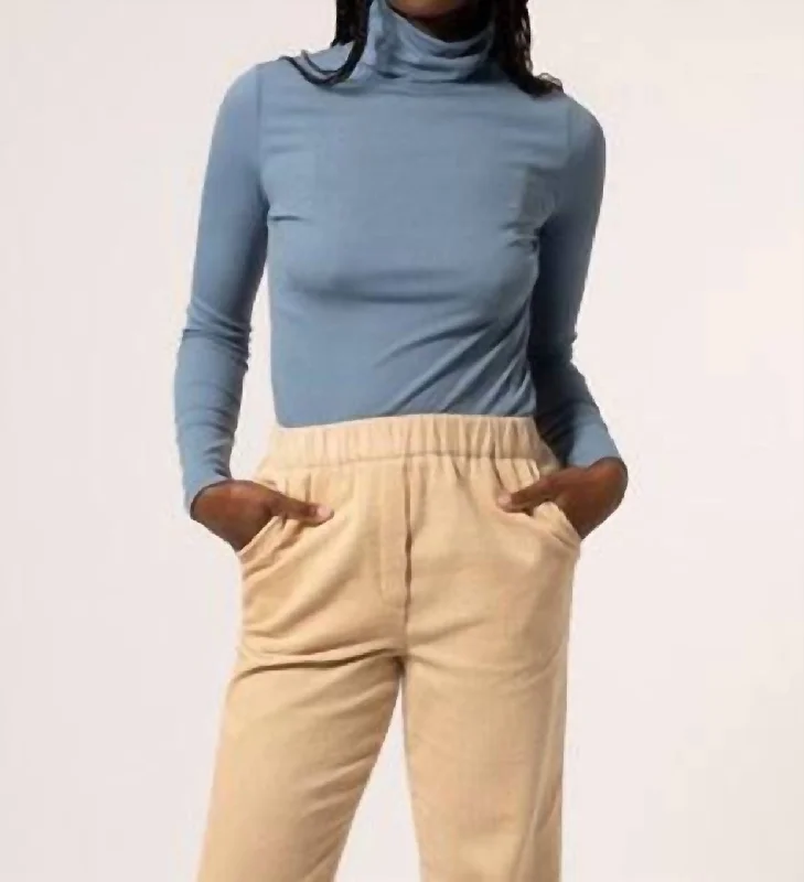 Woven Turtleneck Top In Blue Jean